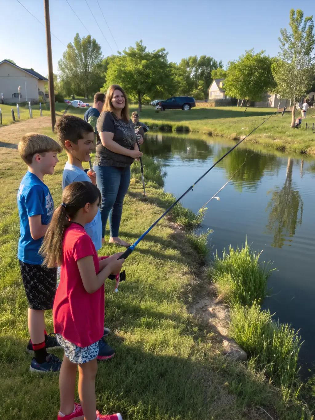 A group of children participating in a fishing workshop, demonstrating the educational programs offered by ASSOCIATION AGREE DE PECHE ET DE PROTECTION DU MILIEU AQUATIQUE LES DEUX VALLEES.